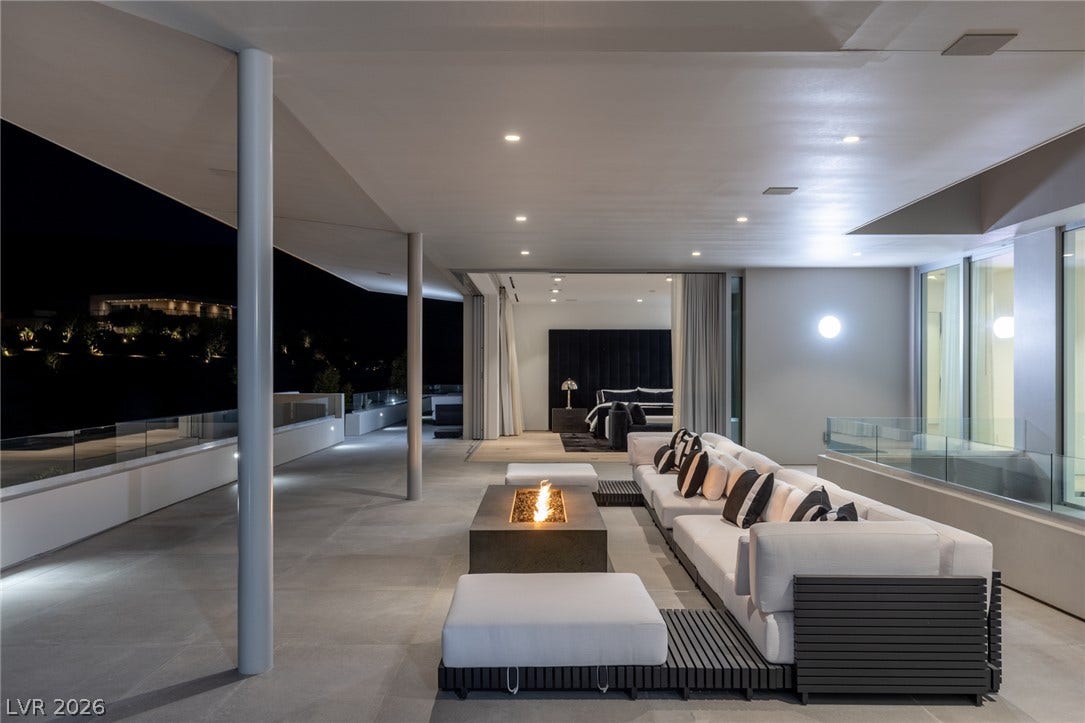An inviting outdoor lounge with a modern fire pit, perfect for evening gatherings under the stars.