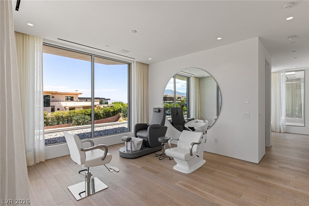 An ideal personal salon space, illuminated by natural light and offering scenic outdoor views.