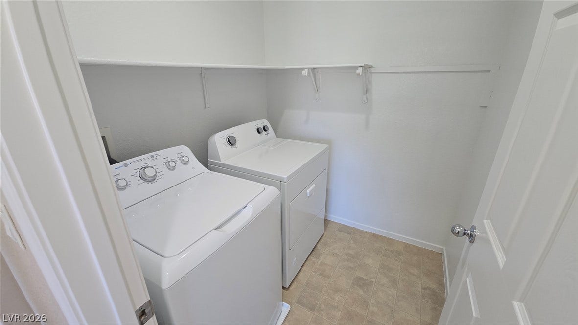 536 Civic Holiday Avenue, North Las Vegas, NV 89031 Functional laundry space features overhead storage shelves and durable tile flooring.
