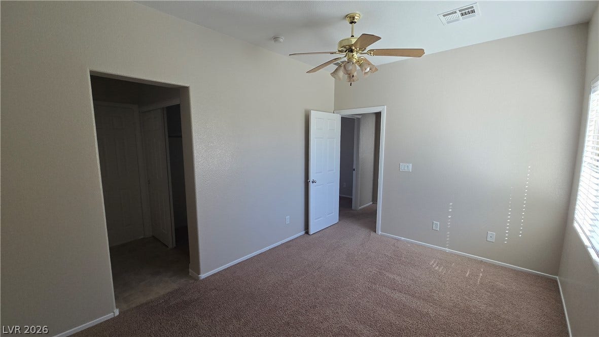 536 Civic Holiday Avenue, North Las Vegas, NV 89031 Plentiful natural light filters through the side window onto neutral carpeting.