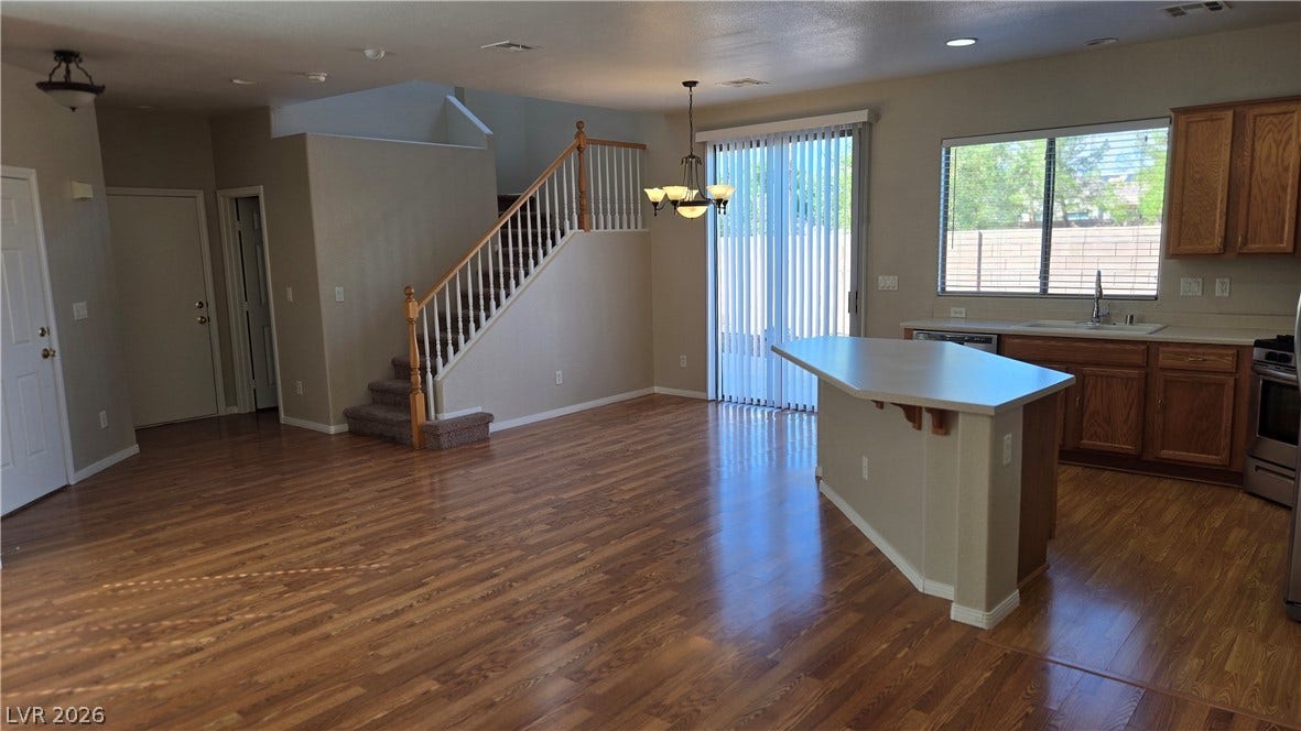 536 Civic Holiday Avenue, North Las Vegas, NV 89031 Gleaming hardwood floors and a spacious kitchen island anchor this open-concept layout.