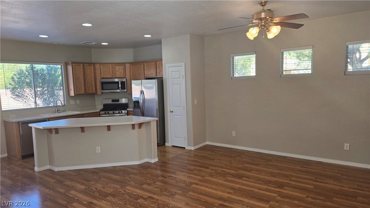 536 Civic Holiday Avenue, North Las Vegas, NV 89031 Gleaming hardwood floors and a spacious kitchen island anchor this open-concept layout.