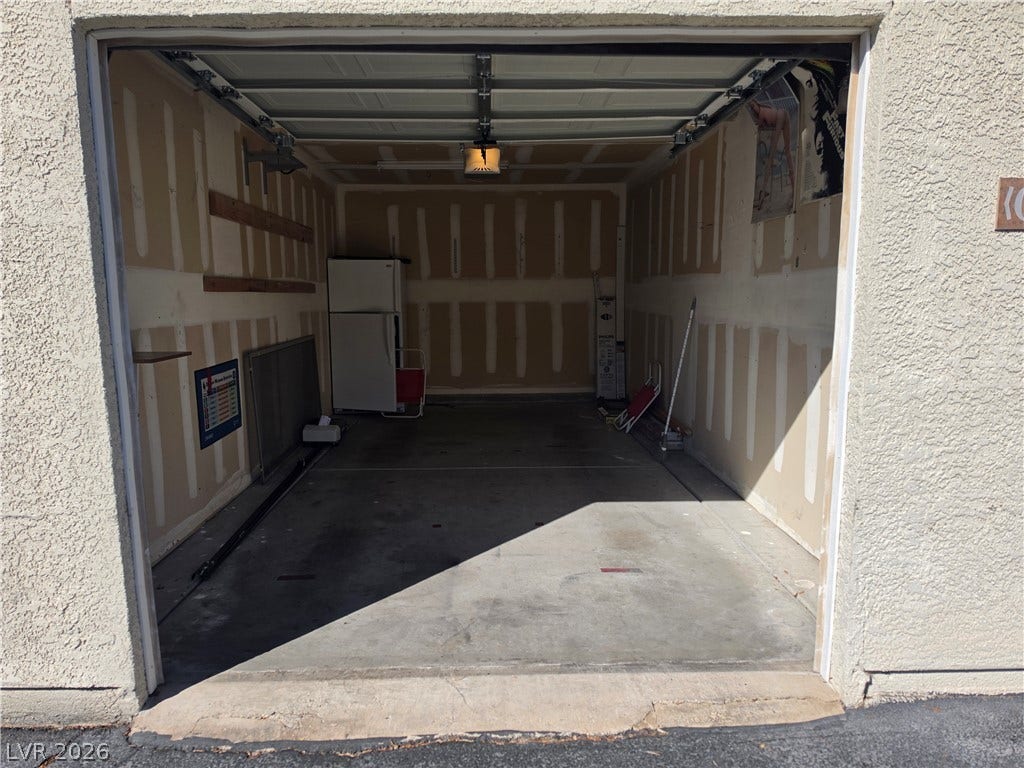 8000 W Badura Avenue, #2111, Las Vegas, NV 89113 Functional garage space features concrete flooring and structured drywall.