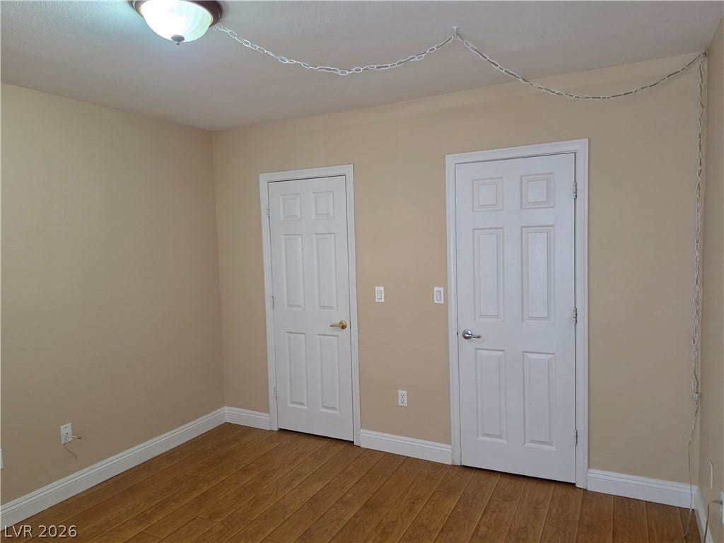 8000 W Badura Avenue, #2111, Las Vegas, NV 89113 Gleaming hardwood floors and classic six-panel doors define this versatile interior space.