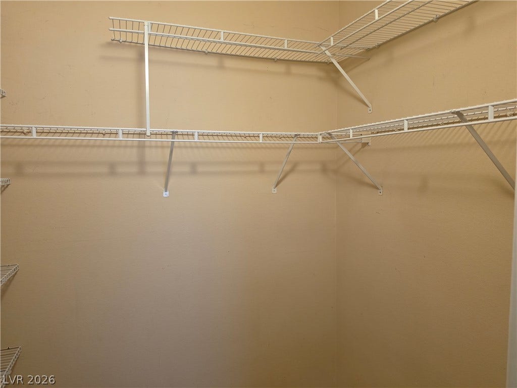 8000 W Badura Avenue, #2111, Las Vegas, NV 89113 Ample built-in wire shelving provides excellent storage potential in this walk-in closet.
