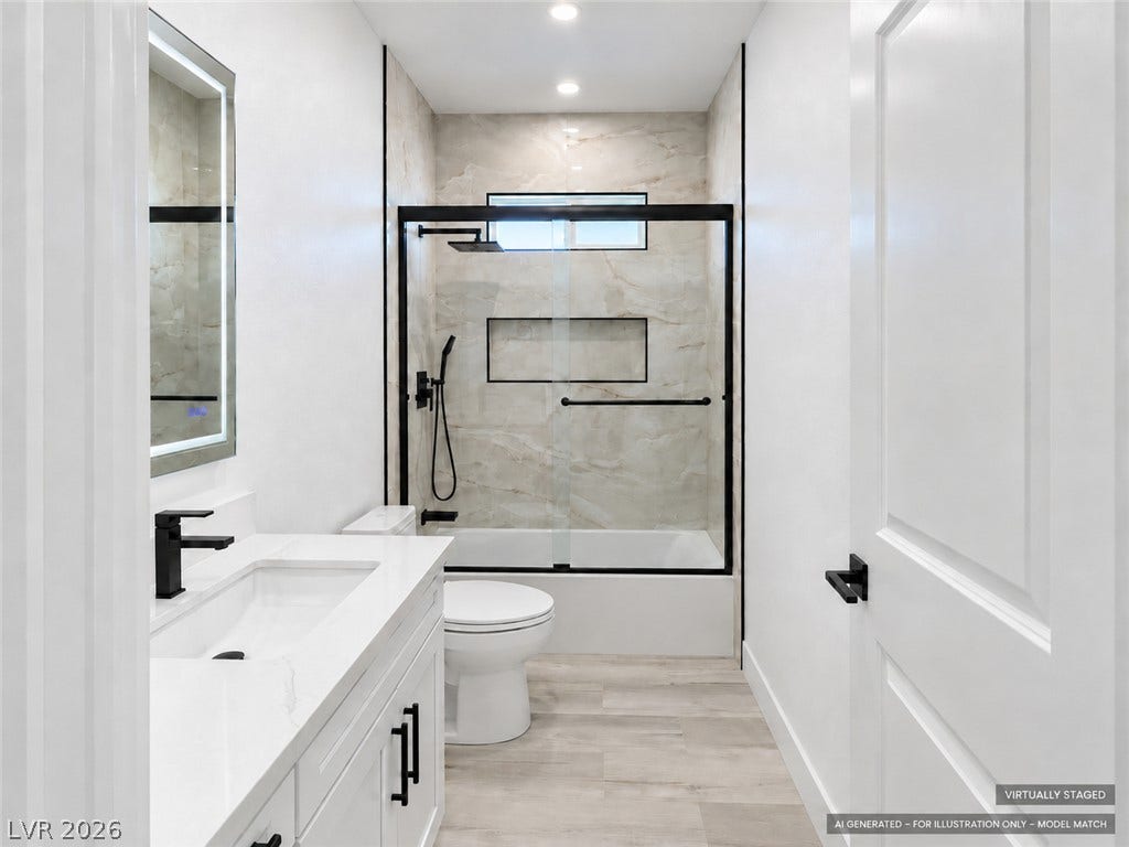 Virtually staged. Modern stone counters and custom tilework define this sleek contemporary bathroom space.