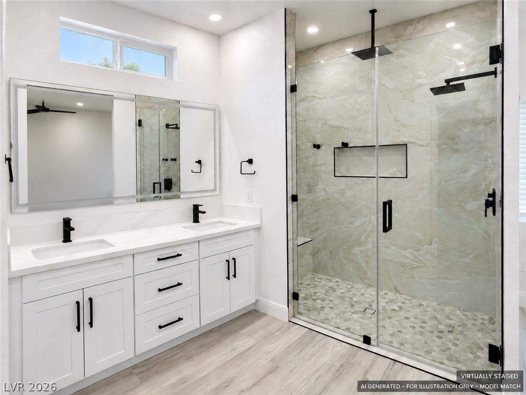 Virtually staged. Clean lines and a spacious walk-in shower define this modern primary bath.