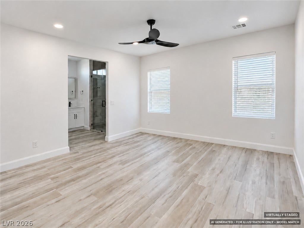 Virtually staged. Plentiful natural light and clean lines define this inviting primary suite with an attached bath.
