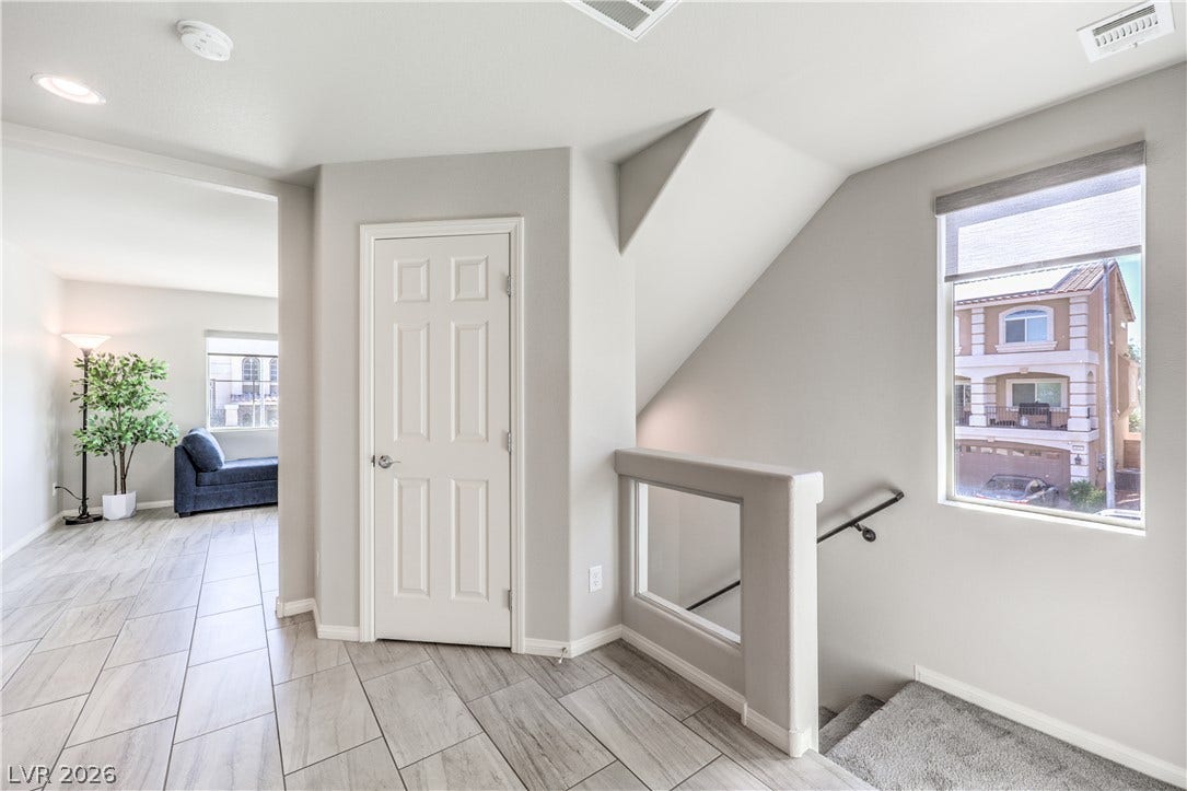 9267 Galen Glen Court, Las Vegas, NV 89139 Clean lines and multi-textured flooring define this bright, versatile upper-level landing space.