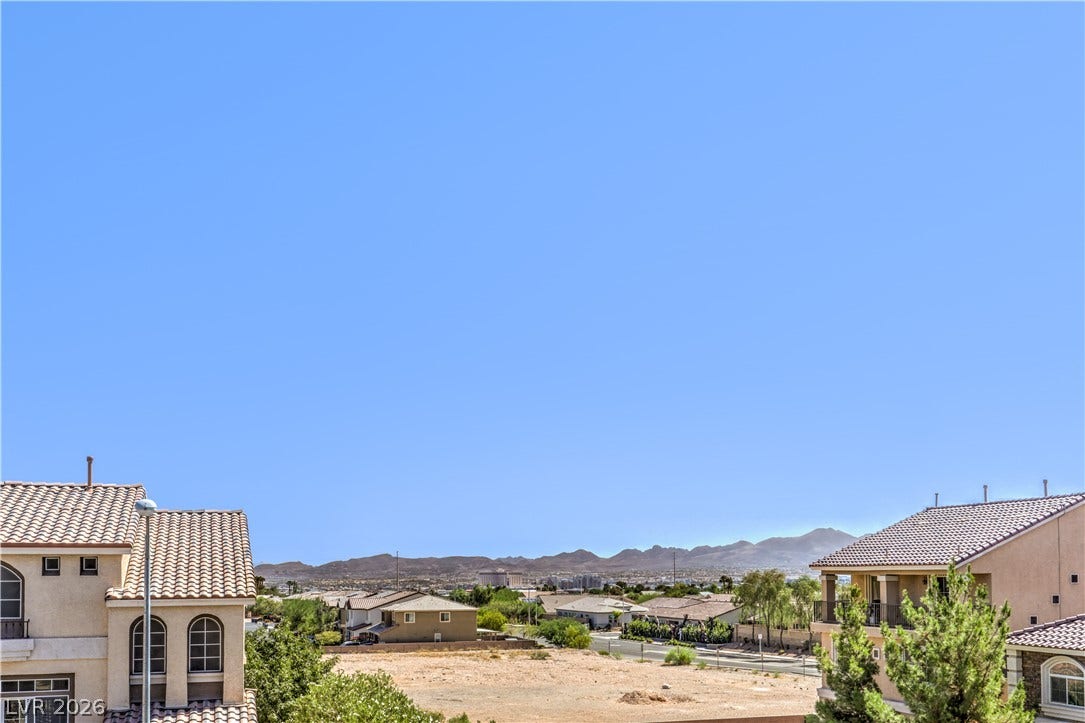 9267 Galen Glen Court, Las Vegas, NV 89139 Distant mountains frame the neighborhood horizon under clear blue skies.