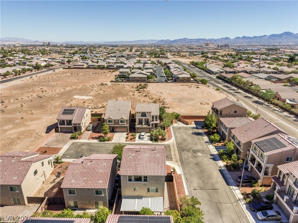 9267 Galen Glen Court, Las Vegas, NV 89139 An aerial perspective captures the neighborhood setting framed by distant mountain ridges.