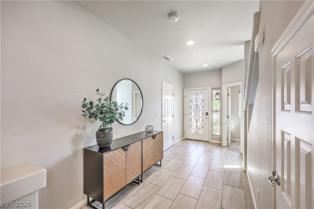 9267 Galen Glen Court, Las Vegas, NV 89139 A welcoming entryway with durable tile flooring leads into an airy, light-filled layout.