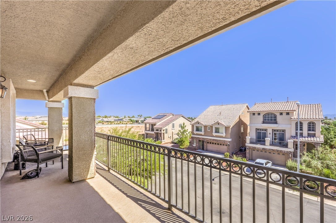 9267 Galen Glen Court, Las Vegas, NV 89139 A sheltered 3rd level balcony overlooks the neighboring suburban streets, the Las Vegas Strip and endless mountain views.