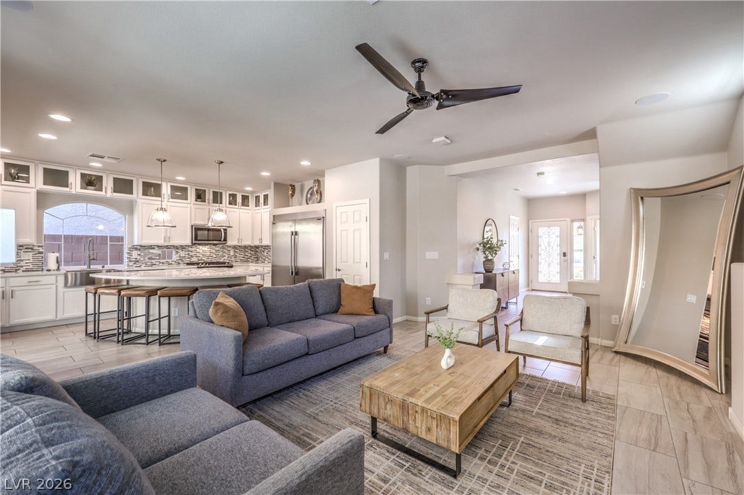 9267 Galen Glen Court, Las Vegas, NV 89139 An open floorplan seamlessly connects the comfortable living area directly to the spacious kitchen.