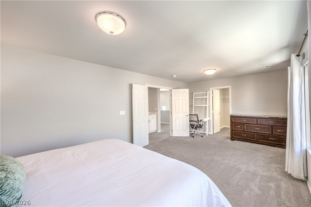 9267 Galen Glen Court, Las Vegas, NV 89139 Plush carpeting and and a large walk-in closet highlights this generously sized 4th bedroom layout.