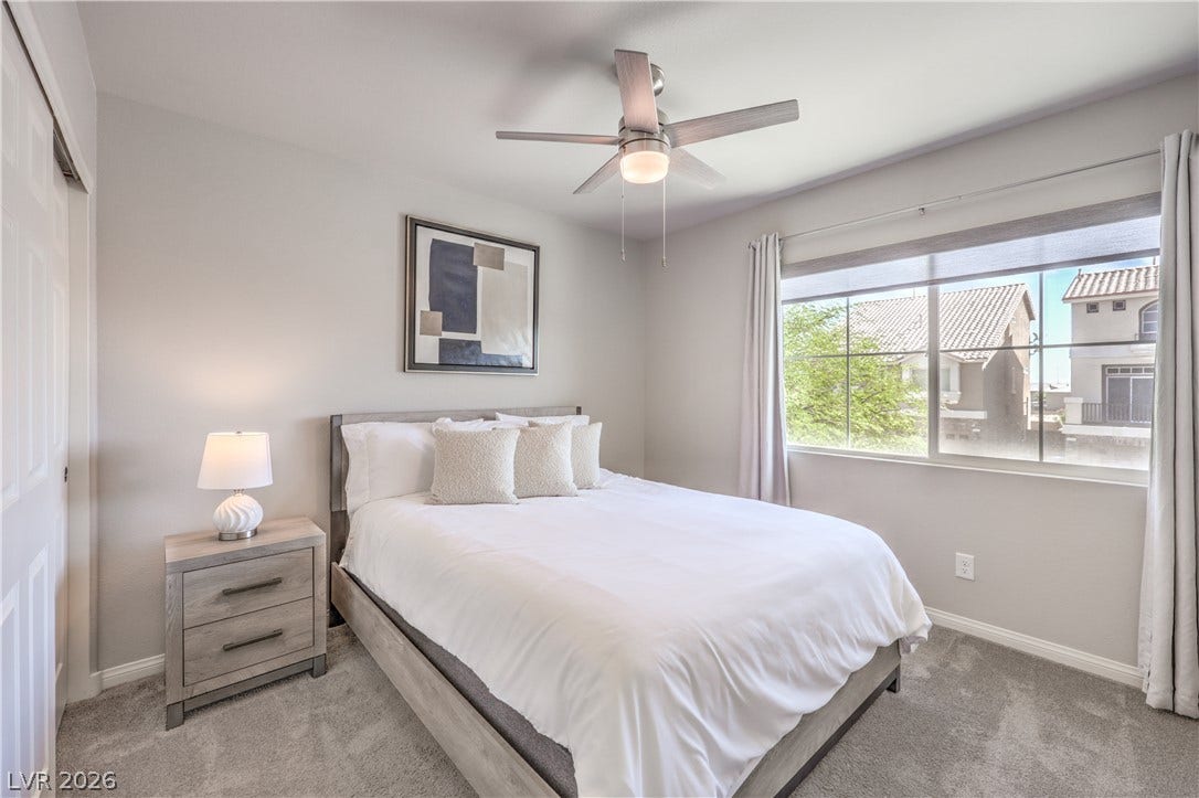 9267 Galen Glen Court, Las Vegas, NV 89139 2nd Bedroom with plush carpeting and a wide window create a comfortable, inviting atmosphere.