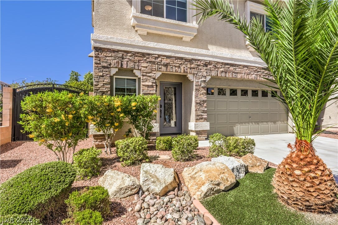 9267 Galen Glen Court, Las Vegas, NV 89139 Stone accents and a landscaped desert garden create a welcoming approach to the entrance.