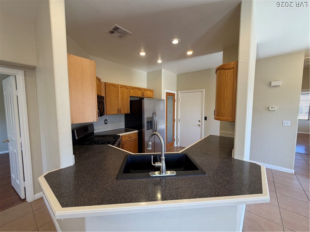 An open layout kitchen flows effortlessly into the surrounding living areas.