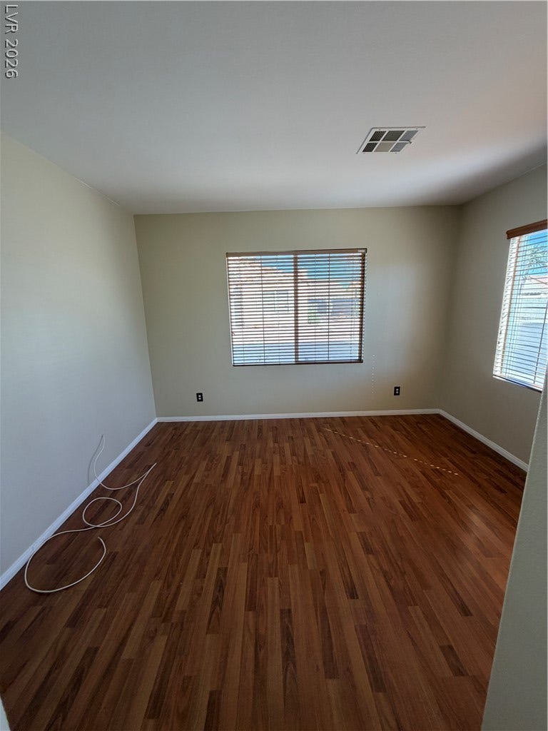 Gleaming hardwood floors and a bright skylight define this versatile living space.