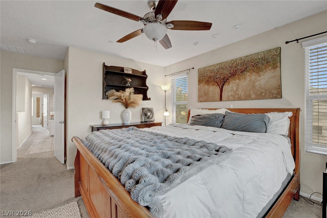 3924 Juanita May Avenue, North Las Vegas, NV 89032 Natural light fills this relaxing bedroom detailed with soft carpeting and recessed lighting.