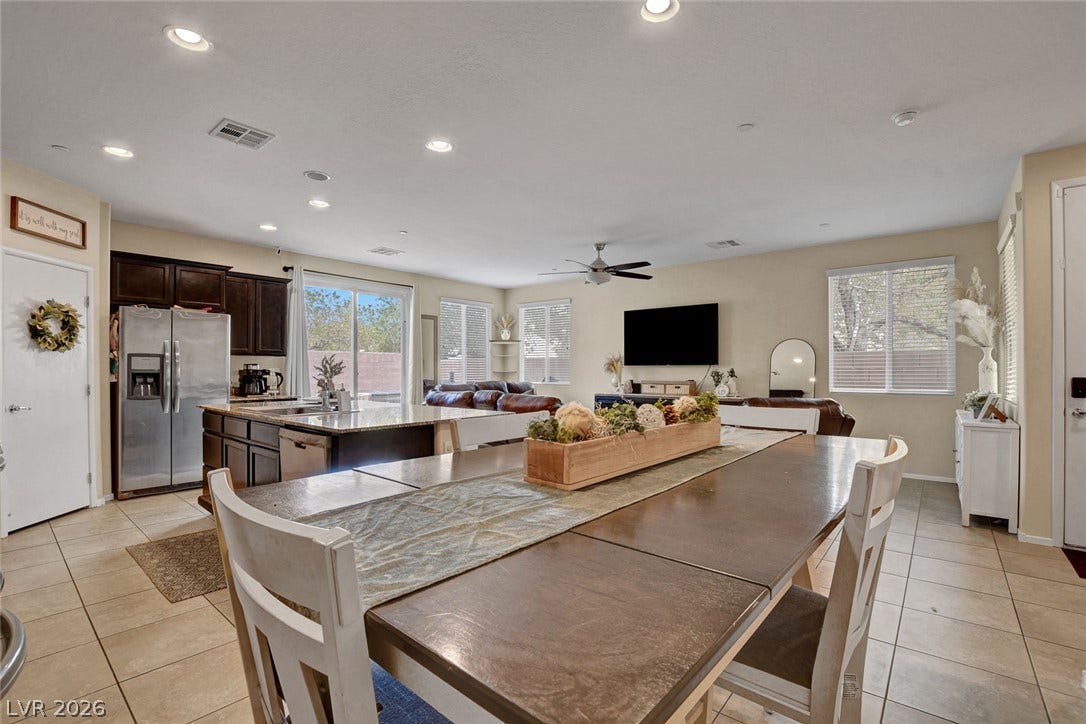 3924 Juanita May Avenue, North Las Vegas, NV 89032 An open floor plan seamlessly connects the kitchen and dining area over tiled flooring.