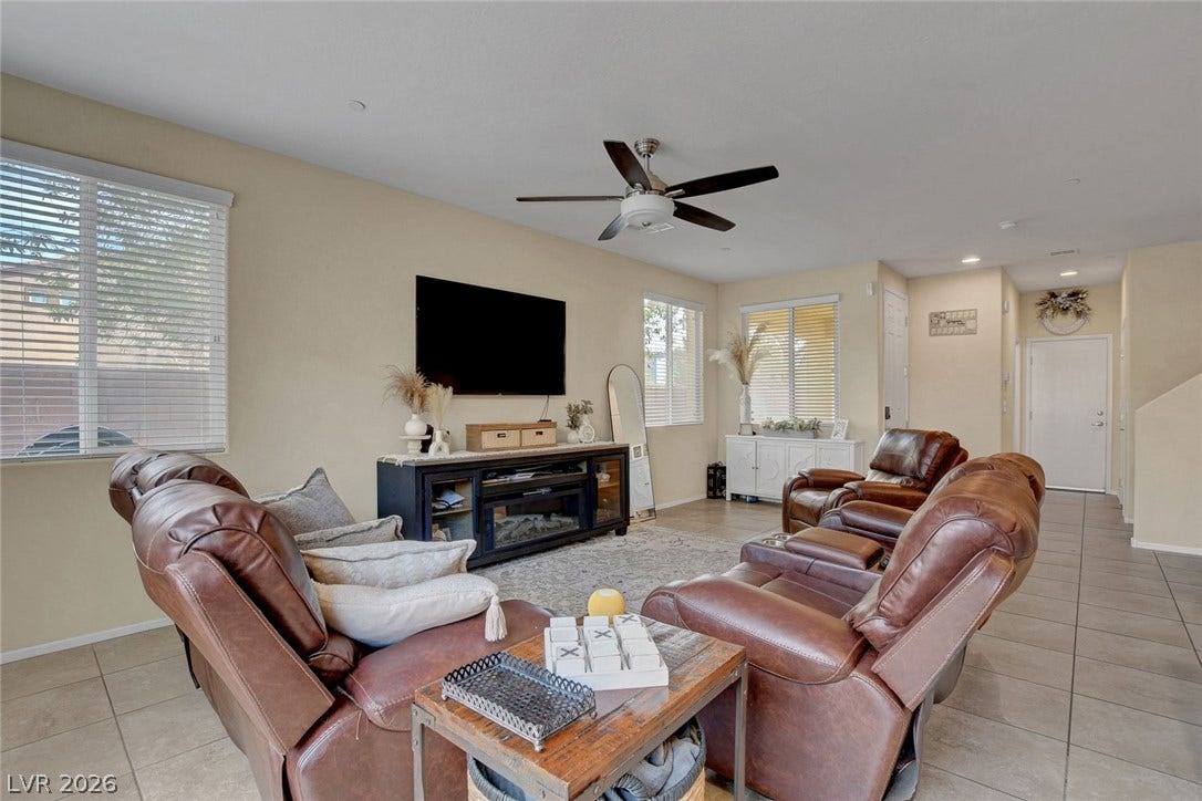 3924 Juanita May Avenue, North Las Vegas, NV 89032 An open living room features expansive tiled flooring and recessed lighting.