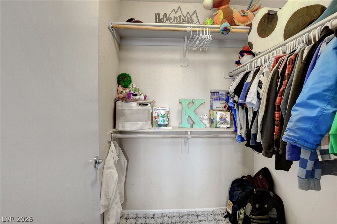 3924 Juanita May Avenue, North Las Vegas, NV 89032 Ample built-in shelving maximizes storage potential inside this walk-in closet space.