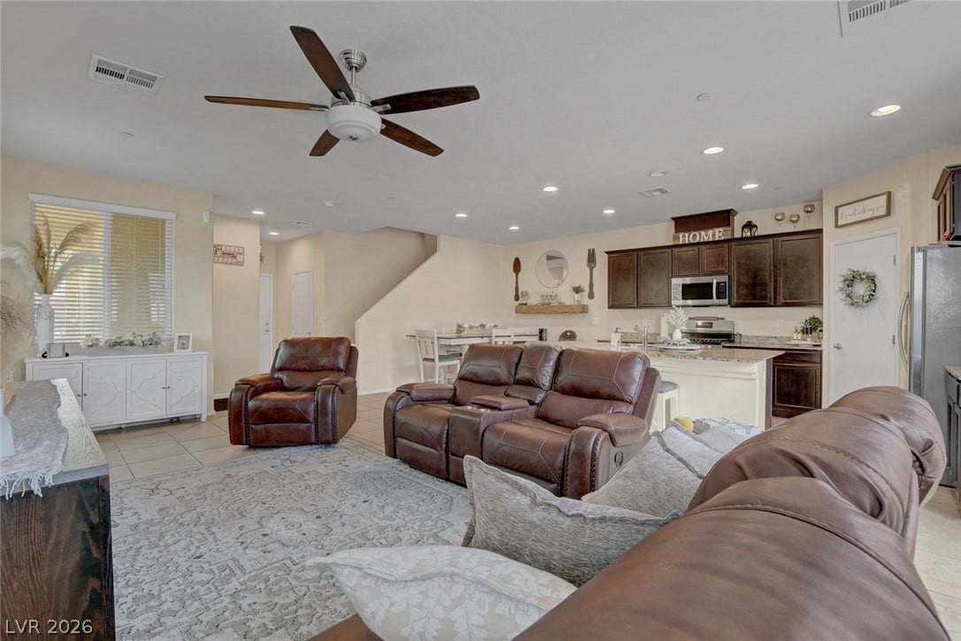 3924 Juanita May Avenue, North Las Vegas, NV 89032 An open floorplan seamlessly connects the casual living space to the adjacent kitchen and dining area.