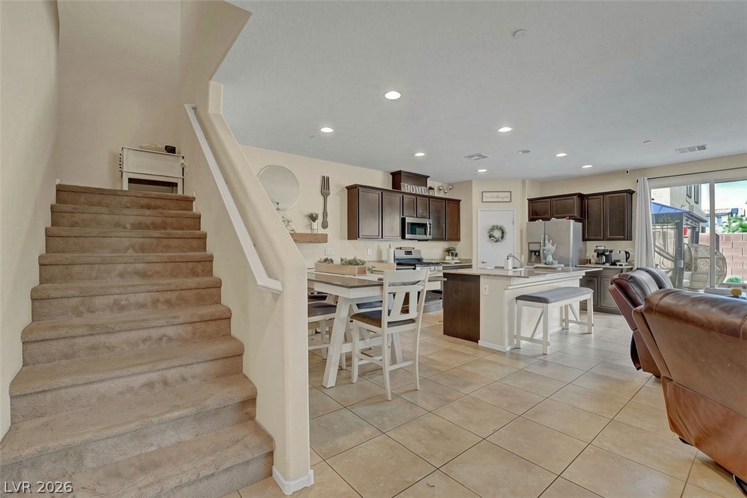 3924 Juanita May Avenue, North Las Vegas, NV 89032 Tile flooring and recessed lighting span this open-concept layout connecting the kitchen and living areas.