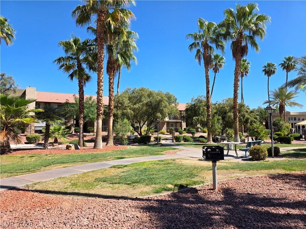 4470 Sandy River Drive, #54, Las Vegas, NV 89103 Manicured lawns and soaring palm trees frame the inviting common areas of this desert community.
