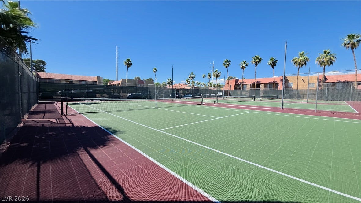 4470 Sandy River Drive, #54, Las Vegas, NV 89103 Multiple outdoor sports courts sit under clear skies, flanked by tall palm trees.