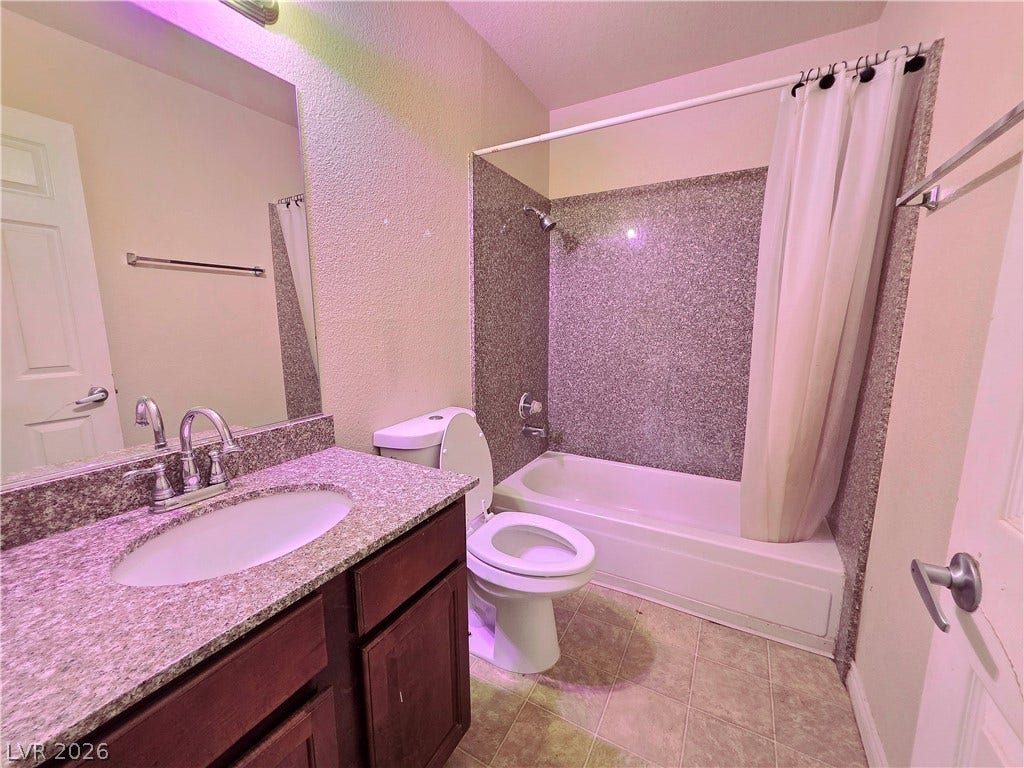 4470 Sandy River Drive, #54, Las Vegas, NV 89103 An integrated vanity and classic tub shower combination define this functional bathroom layout.