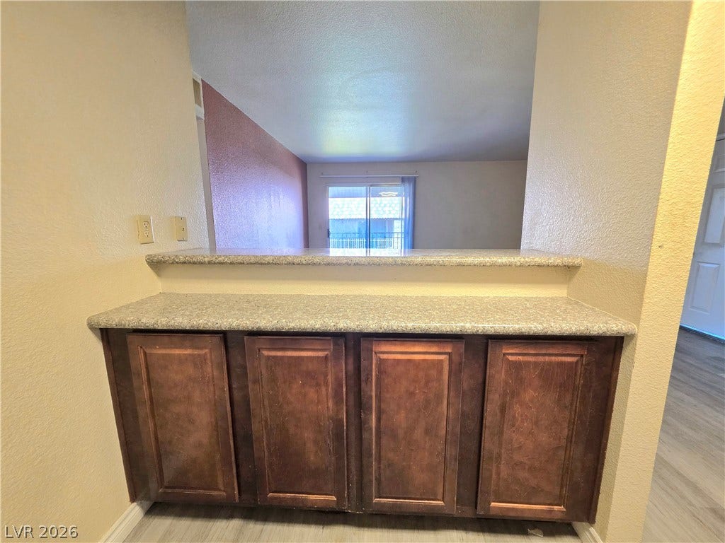 4470 Sandy River Drive, #54, Las Vegas, NV 89103 A pass-through counter connects the kitchen to the bright living areas beyond.