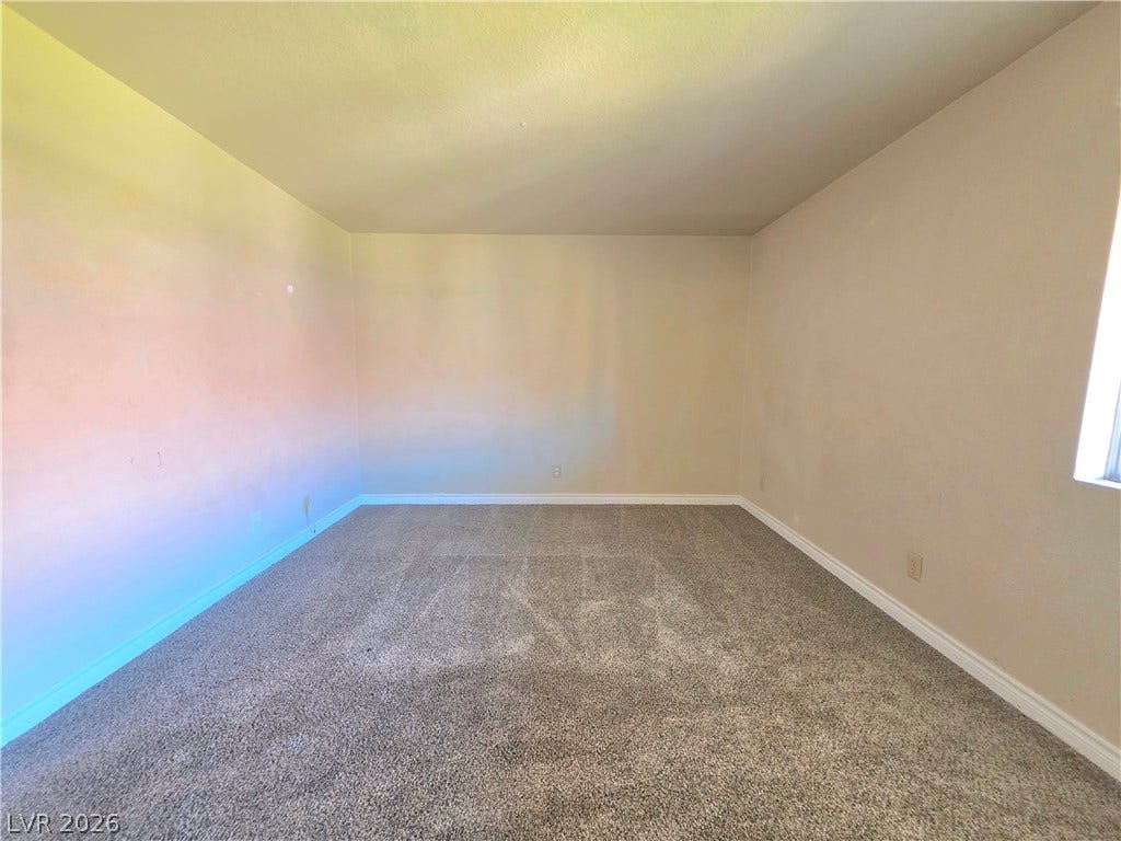 4470 Sandy River Drive, #54, Las Vegas, NV 89103 Soft carpeting underfoot creates a comfortable foundation for this versatile room.