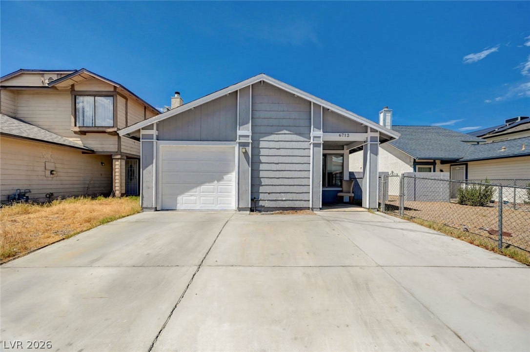 6712 Accent Court, Las Vegas, NV 89108 A wide concrete driveway leads to this classic single-story home with integrated garage parking.