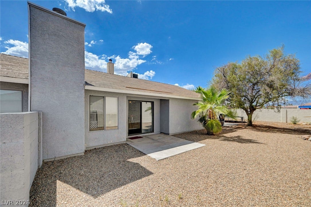 6712 Accent Court, Las Vegas, NV 89108 An inviting gravel yard extends from the stucco exterior under clear desert skies.
