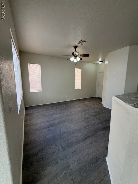2506 Lady Elizabeth Court, North Las Vegas, NV 89031 Gleaming wood floors anchor this open living area boasting high vaulted ceilings and abundant natural light.