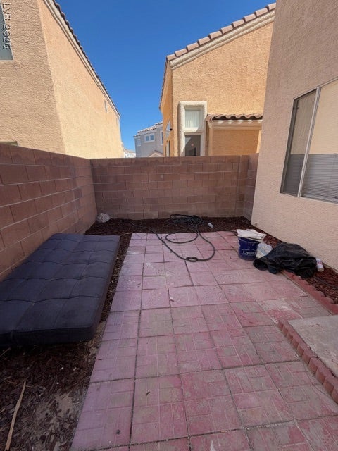 2506 Lady Elizabeth Court, North Las Vegas, NV 89031 An enclosed outdoor area features block retaining walls and paved ground surfacing.