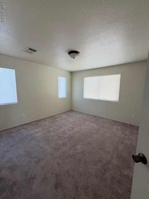 2506 Lady Elizabeth Court, North Las Vegas, NV 89031 High ceilings and soft carpeting define this inviting living space filled with natural light.