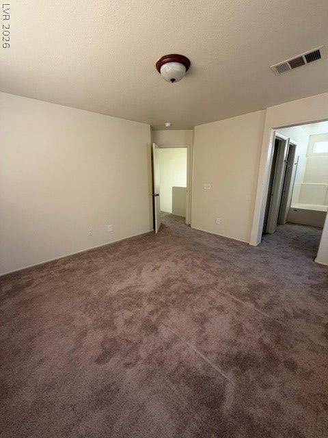 2506 Lady Elizabeth Court, North Las Vegas, NV 89031 Plush carpet flooring runs throughout this versatile space leading to an adjacent bathroom.