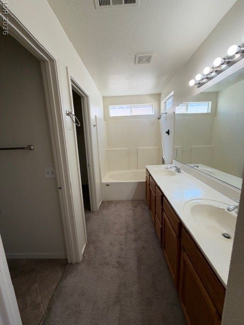 2506 Lady Elizabeth Court, North Las Vegas, NV 89031 A spacious vanity area connects seamlessly with the private bath fixtures.