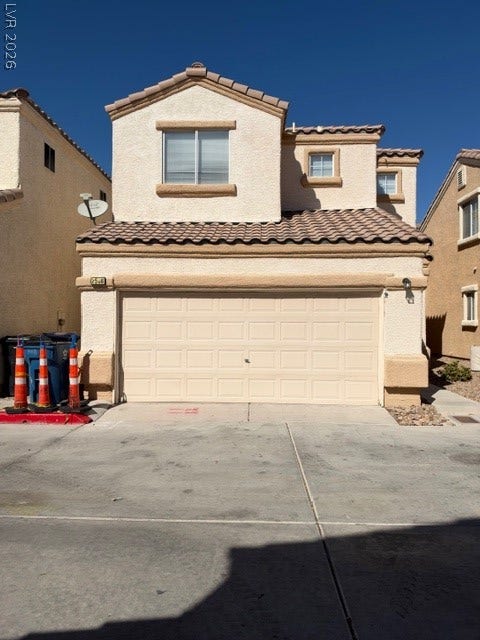 2506 Lady Elizabeth Court, North Las Vegas, NV 89031 A stucco exterior and tiled roofline define this classic multi-level residence.