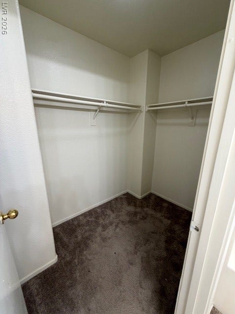 2506 Lady Elizabeth Court, North Las Vegas, NV 89031 Ample hanging rods and built-in shelving maximize storage space within this walk-in closet.