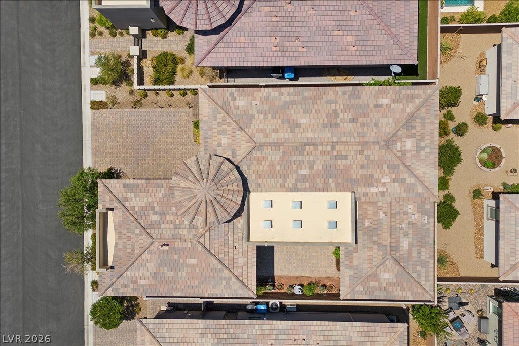 6722 Desert Crimson Street, Las Vegas, NV 89148 An aerial perspective showcases the distinctive architectural rooflines and tile detailing of the residence.