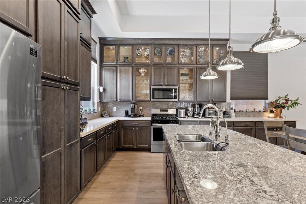 6722 Desert Crimson Street, Las Vegas, NV 89148 Ample cabinetry, premium stone countertops, and a central island ground this culinary space.