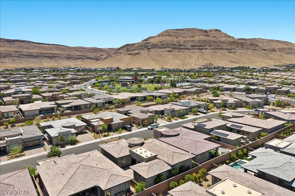 6722 Desert Crimson Street, Las Vegas, NV 89148 Dramatic mountain vistas rise above the peaceful desert neighborhood.