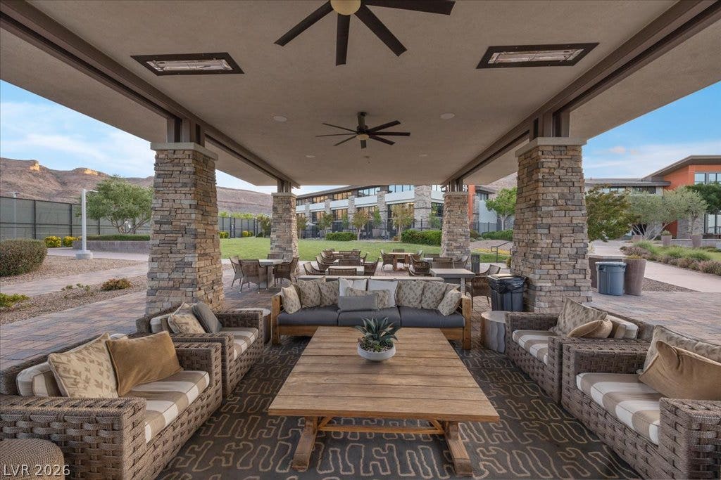 6722 Desert Crimson Street, Las Vegas, NV 89148 A spacious covered patio features robust stone columns and panoramic views of the surrounding hills.