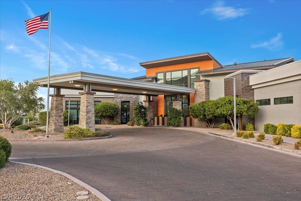 6722 Desert Crimson Street, Las Vegas, NV 89148 An inviting stone-accented entryway features a generous porte-cochere and beautifully paved circular drive.