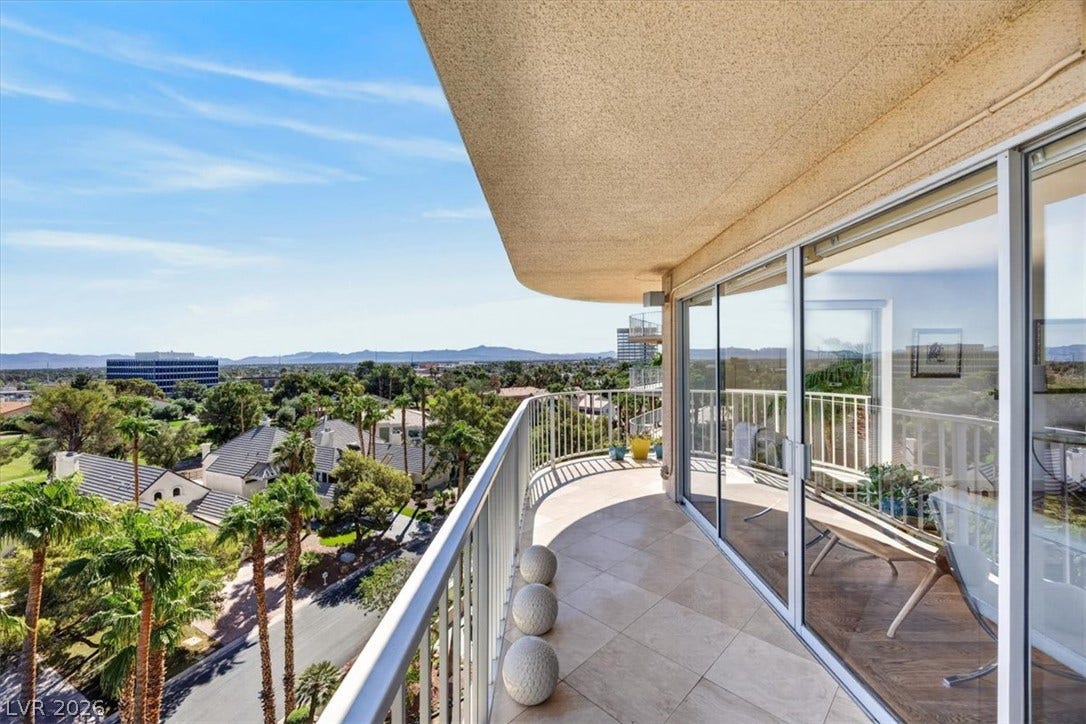 3111 Bel Air Drive, #7D, Las Vegas, NV 89109 Tiled private balcony offers wide scenic views of the surrounding neighborhood and mountains.