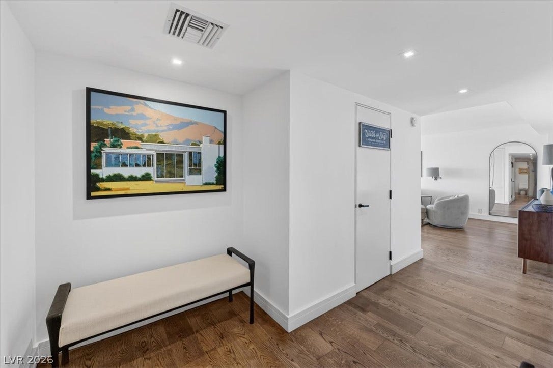 3111 Bel Air Drive, #7D, Las Vegas, NV 89109 Gleaming hardwood floors and crisp white walls define this welcoming entrance foyer.